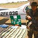 Soldado posa ao lado de aeronave e dos entorpecentes: brasileiro está entre presos
